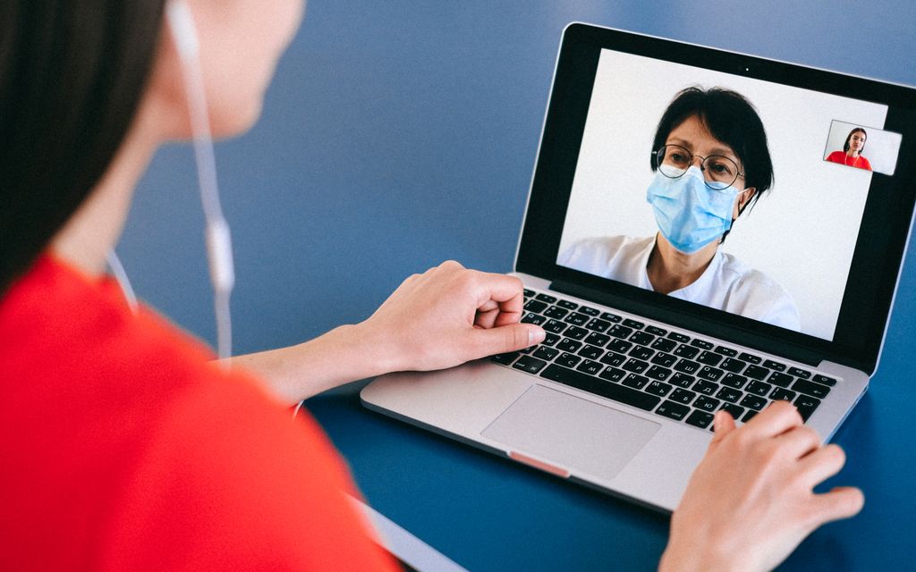 Patient using a telehealth video visit with a doctor during a Florida hurricane evacuation