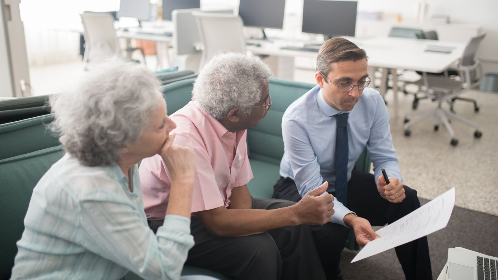 Licensed insurance agent helping an elderly Florida couple file Form SSA-44 to appeal a 2026 Medicare IRMAA surcharge